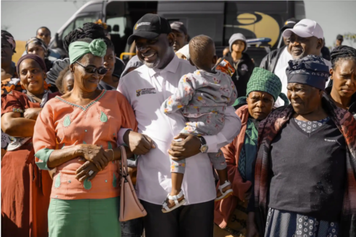 Dr. Collen Mashawana with community members at a Foundation handover